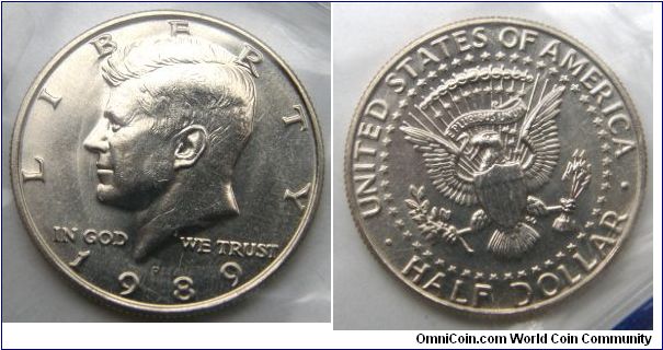 Kennedy Half Dollar,Metal content:
Outer layers - 75% Copper, 25% Nickel
Center - 100% Copper. 1989P-Mintmark: P (for Philadelphia, PA) centered above the date
UNITED STATES UNCIRCULATED COIN(MINT) SET.