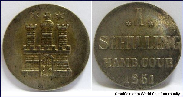 German States - Free City Regular Coinage, Schilling, 1851. Obverse: City Arms (A triple-turreted gate). Reverse: 'I' between six-pointed stars, value. 1.0800 g, 0.3750 Silver, .0130 Oz. ASW. Mintage: 240,000 units. aXF.