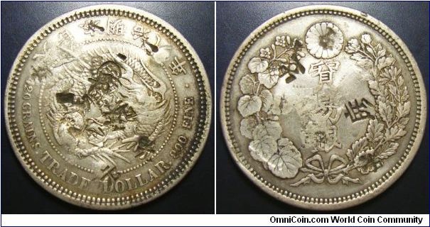 Japan 1875 trade dollar, chopmarked. One of the toughest coins to find out of the entire Japanese silver coinage as well as the world trade dollar series that were around at that time. 3 year type with a total mintage of 3 million but significantly melted down as it wasn't popular. Weights 27.2g which is right for this type.