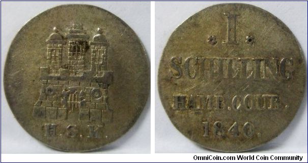 German States - Hamburg, Free City regular coinage, Schilling, 1840 HSK. 1.08g, 0.3750 Silver, .0130 Oz. ASW. Obv.: Castle with H.S.K.. Rev.: 'I' between rosettes. Rev. Legend: HAMB.COUR. Mintage: 144,000 units. VF.