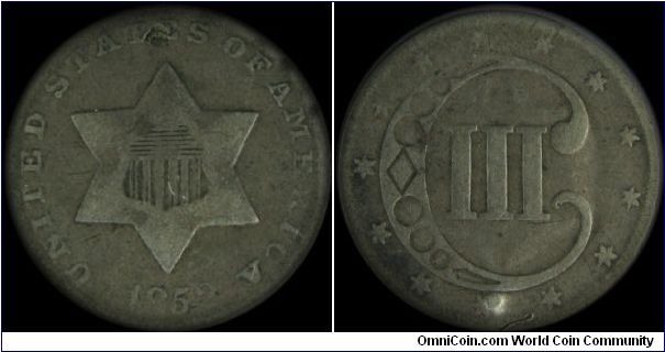 1852 3 cent silver coin. Holed and plugged. Indirect design transfer.