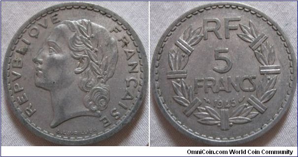 aluminium 5 francs, simple design, and cheap metal a common thing after the war, has seen use as seen by the rubbing on obverse, some lustre traces between lettering on reverse
