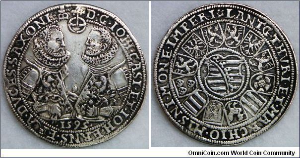 German States, Sachsen Coburg Eisenach Thaler, 1595. Johann Casimir, Duke of Saxe-Coburg (b. Gotha, 12 June 1564 - d. Coburg, 16 July 1633),  and Johann Ernst, Duke of Saxe-Eisenach (b. Gotha, 9 July 1566 - d. Eisenach, 23 October 1638), 1572 - 1633. 28.54g, Silver, 40mm. Nice very fine.