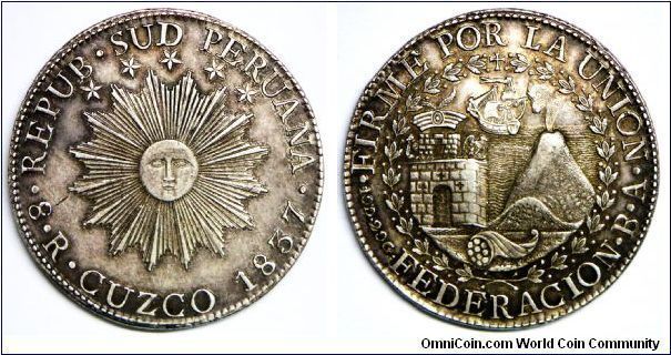Republic, South-Peru 8 Reales, 1837, Assayer BA. Radiant human faced sun, five stars above. Rev. Tower, cornucopiae in foreground and volcano in front, behind ship on sea; all within wreath. Large letter legend FEDERACION. Mint: Cuzco. Edge: Incused legend.  27.17g, 0.9030 silver, .7859 oz. ASW., 38mm. Extra fine.