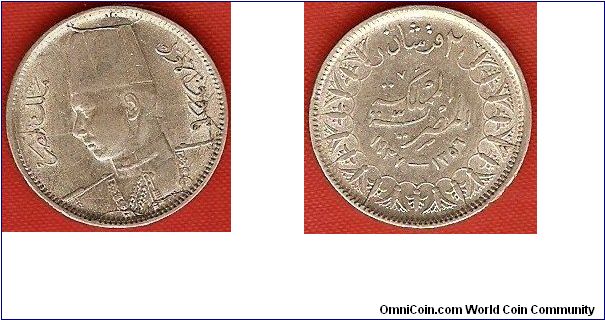 King Farouk
2 piastres
AH1356
0.833 silver
obv.: die crack at top of Fez