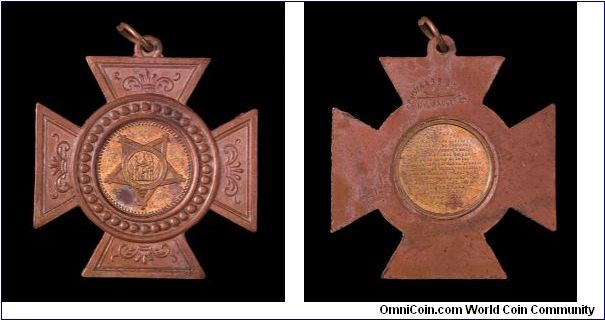 Gilt brass Lord's Prayer medal in ornamental cross.