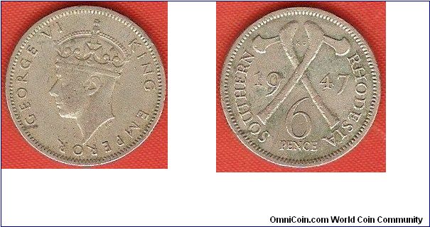 Southern Rhodesia
6 pence
George VI King Emperor, portrait by Percy Metcalfe
crossed axes
copper-nickel