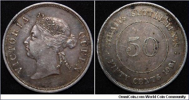 Straits Settlements Victoria 50 cents 1901.
13.5769 g., 0.8000 Silver 0.3492 oz. ASW 
Ruler: Victoria
Obv: Crowned head left 
Obv Leg: VICTORIA QUEEN
Rev: Value with beaded circle
Rev Leg: Straits Settlements
Mintage: 120,000 pieces.
VF+ grade, lucky enough having my hong kong friend to have found & purchase it for me. Million thanks to him.