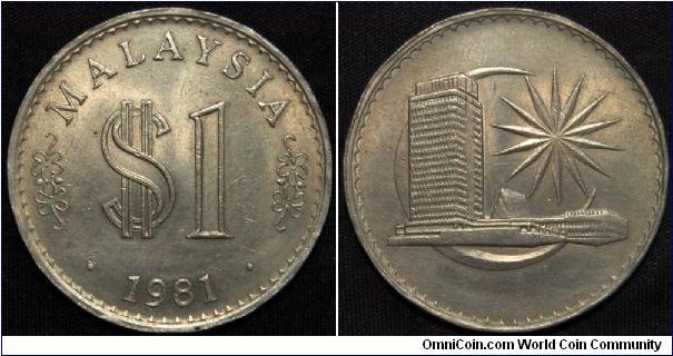 Malaysi 1981 1 Ringgit.
Copper-Nickel, 33.5mm. 
Obv: Artistic value and dollar sign above date
Rev: Parliament house within cresent, BANK NEGARA MALAYSIA
Mintage: 765,000