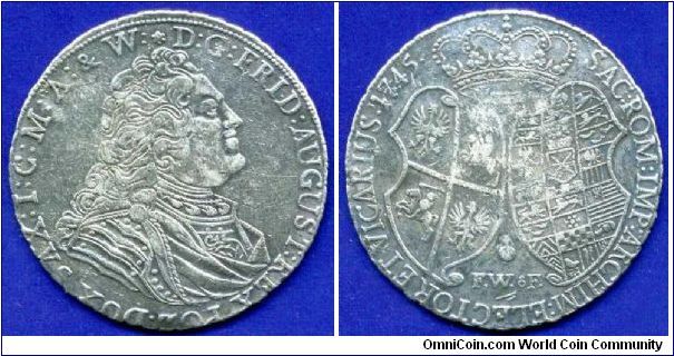 Modern fake (fufel) Polish-Saxon Thaler 1745. 
The field is not smooth, possibly a cast. Very often, these are trying to pass off as real. At prfile image hairstyle is very different from the original. Animals on the coats of arms clumsily executed. Rafting fake like silver, but the sound is different from the silver. Weight 29.3 grams instead of 28.8. In principle, a good attempt to counterfeit. Country-manufacturer unknown. :-))