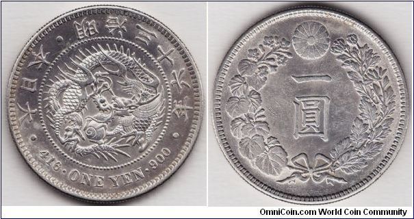 Meiji Yr 36th, Yen, borderline uncirculated specimen, sharp detail with only a few scattered ticks/scuffs. Original luster near the details.  A very nice example.