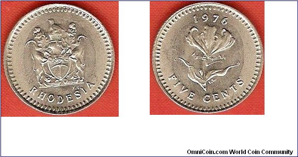 5 cents
state shield
flame lily
copper-nickel