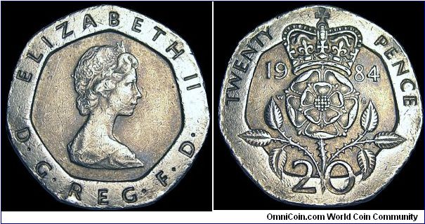 United Kingdom - 20 Pence - 1984 - Weight 5 gr - Copper / Nickel - Size 21,4 mm - Ruler / Elizabeth II - Designer Obverse / Arnold Machin - Designer Reverse / William Gardner - Mintage 65 351 000 - Shape : 7-Sided - Edge : Plain - Reference KM# 931