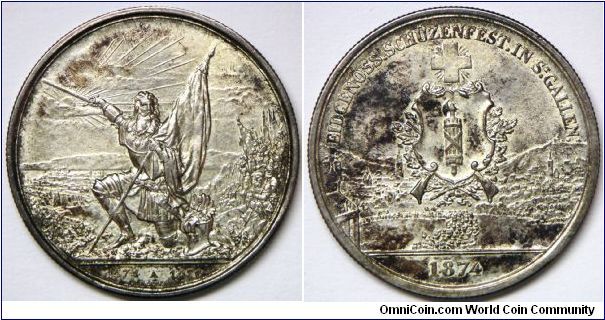 Swiss Shooting Thaler, 5 Francs, 1874. 24.92g, 0.8350 Silver. 37mm. Issuer: St. Gallen. Mintage: 15,000 units. Very high end Choice AU, Near UNC.