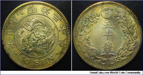 Japan 1897 50 sen. Pretty much uncirculated and wildly toned but there seems to be traces of PVC damage :(. 13.5grams.