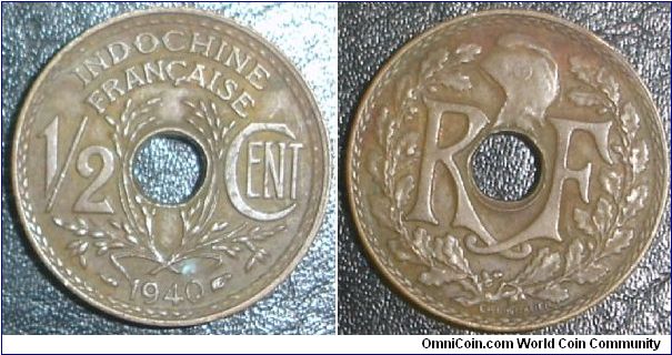 KM# 20 1/2 CENT
Bronze, 21 mm. Obv: Center hole divides RF, liberty cap above,
wreath surrounds Rev: Denomination divided by grain sprigs
around center hole, date below