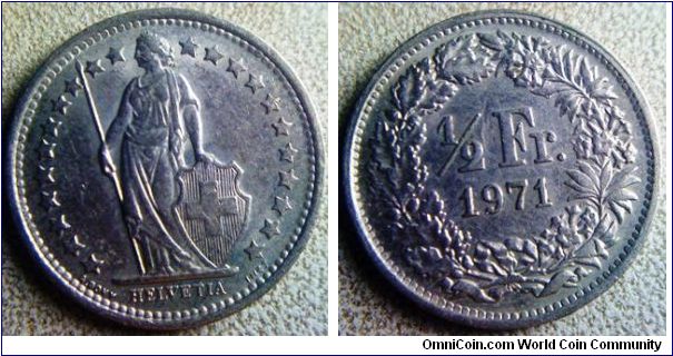Switzerland one and a half Franc 
a small coin at 
18mm diameter