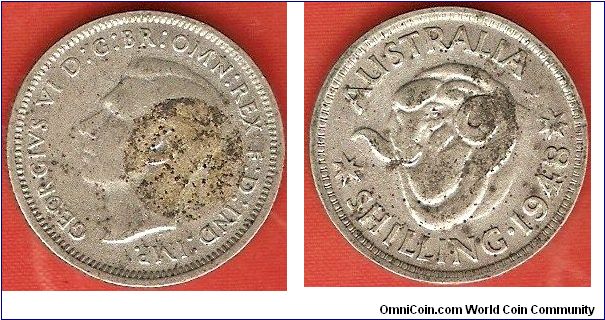 1 shilling
George VI by T.H. Paget (glue spot)
ram's head
0.500 silver
Melbourne Mint