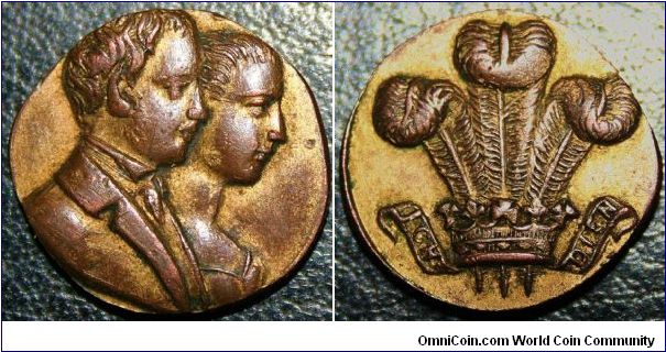 Albert Edward & Alexandra Medalet circa 1863. 19mm gilded bronze struck on a irregular thickish planchet.  Bit of a mystery piece???
