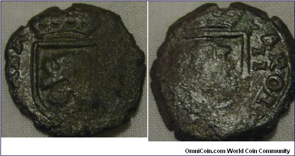 2? Maravedis of charles II fo spain, bigh think copper piece well battered and worn as most of these pieces are.