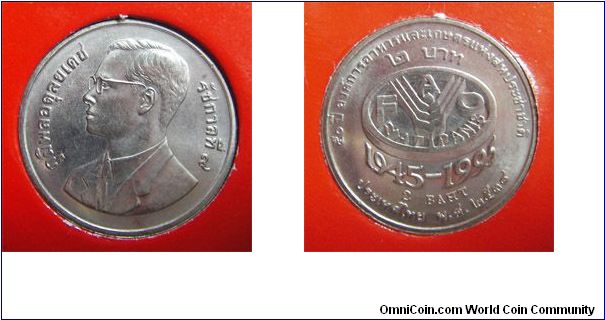 Y# 307 2 BAHT
Copper-Nickel Clad Copper, 22 mm. Ruler: Bhumipol
Adulyadej (Rama IX) Series: F.A.O. 50th Year, 1945-1995