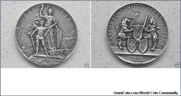 Swiss Shooting Fest.
Luzern Kant.Schützenfest. Engraved by Hugues Bovy. Obv: Knight in front of Helvetia. Rev: Two lions hold banners & 3 shields. Silver. 45MM. Mintage: 800