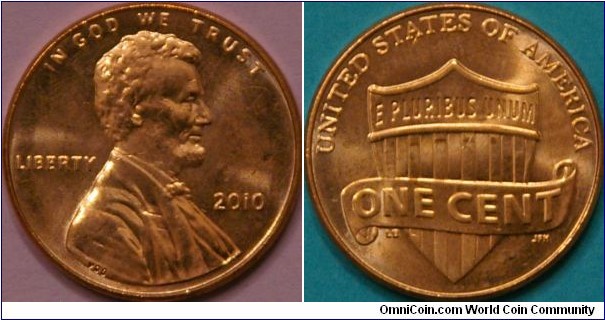 1 Cent, featuring a union shield with a scroll draped across. Finally got one in circulation (June). Cu plated Zn, 19 mm