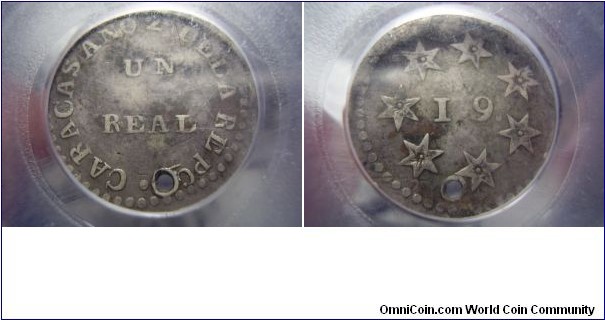 One of the rarest coin in Venezuelan history.Miranda coinage.Tiny hole below the A of PCA, very rare silver type struck during the early years of the Republic. The 19 on the reverse refers to the 19th of April, 1810, the day the Spanish general abandoned Caracas. The seven stars represent the provinces which formed this first union. Less than 20 examples are known to exist.