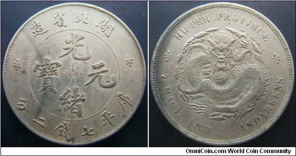 China Hubei ND (1894) dollar coin. Nice chunk of silver! Normally found with lots of chopmarks but this has just nice wear. Getting pricy these days. Weight: 26.9g 