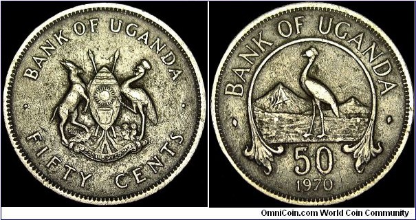 Uganda - 50 Cents - 1970 - Weight 4,4 gr - Copper / Nickel - Size 22 mm - President / Milton Obote (1966-71) - Obverse / National Arms - Reverse / East African crownd crane, mountains and value - Edge : Reeded - Mintage 3 000 000 - Reference KM# 4 (1966-74)
