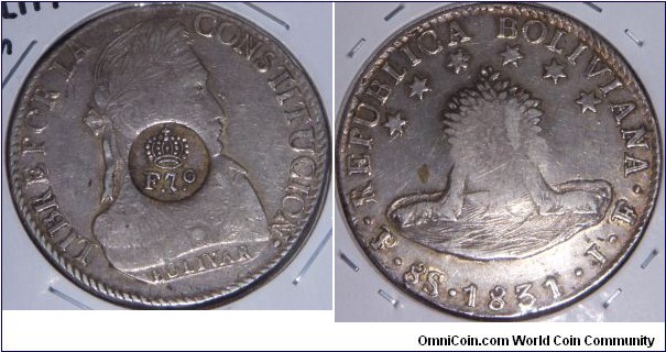 Host coin: 1831 8 reales of Bolivia, Potosi mint, Assayer JF.

Counterstamp of Ferdinand VII of Spain for the Philippines.  Counterstamp matches the description for the 1832 die. Crown is 5-3-1.