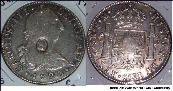 Host Coin: 1773 8 Reales of Mexico, minted at Mexico City, Assayer FM.

In 1797, because of a desperate shortage of silver coins, half a million pounds worth of Spanish dollars issued by Charles IV were overstamped by the Bank of England with a small engraving of George III, resulting in the popular description of 
