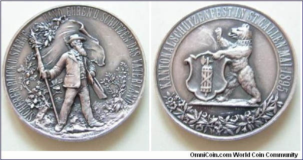 Swiss Shooting Fest St. Gallen by Franz Homberg,Silver 45MM. Mintage: 800
Obv: Rampant bear holding Coat of Arms of Sy. Gallen with floral wreath below. Legend KONTANALSCHUTZENFEST IN ST.GALLEN.MAI 1895. Rev: Standing rifleman holding flag of Switzerland with olive wreath. On each side small oak and olive trees. Legend