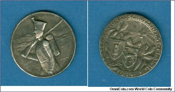 Swiss St. Gallen Kantonal Schutzenfest in Flawll engraved by Holly Freres, St. Imier. Obv: Soldier matching left. Rev: Arms placed on pine branch, national arms radiant above. Silver 27 MM
