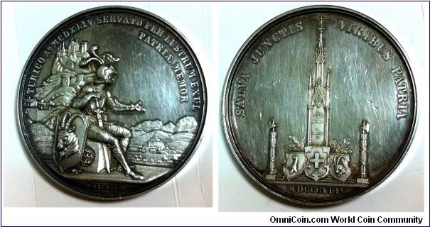 1844 Swiss Battle St. Jacques sur la Birse Medal engraved by Jacob Friedrich Aberli, Silver 52 MM.
Obv: A knight seated resting on his sword with a shield at his side that has a ram. Behind and above, a castle on a mountain. To the right the knight points to a city. Legend: Turico Ao MCDXXLIV (1844) Servato Per Lustrum Exul Patriae Memor. Rev: SpiralTower. Legend: SALVA JUNCTIS VIRIBUS PATRIA. 
