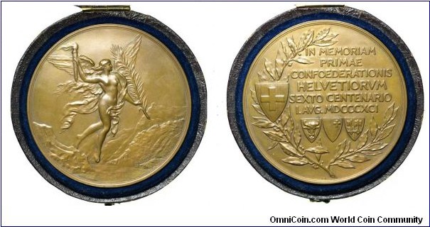 Swiss Confederation 600th Anniversary dedicate to first Confederation of Helvetia Medal
engraved by Alphee Dubois. Obv: Angel flying over Swiss mountain holding a torch & branch. Rev: Legend with first confederation cantons shield all in wrath with nation arms on it. , Bronze  70MM 
