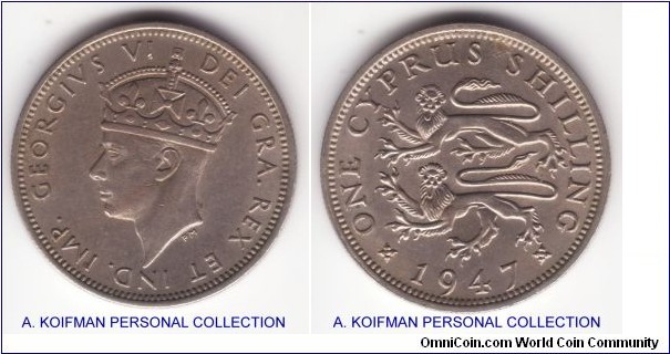 KM-27, 1947 Cyprus shilling; copper nickel, reeded edge; nice about uncirculated to uncirculated specimen, quite a bit of luster there