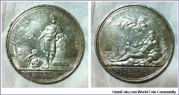 Sweden Commemorative Medal. First Jubilee of Bank of Stockholm by Gustav Ljungberger. Silver 64MM 
Obv: Classical figure of man protecting basket of coins from Monster. Rev: River God of the Nile reclines by Palm, 2 pyramids in distance.
