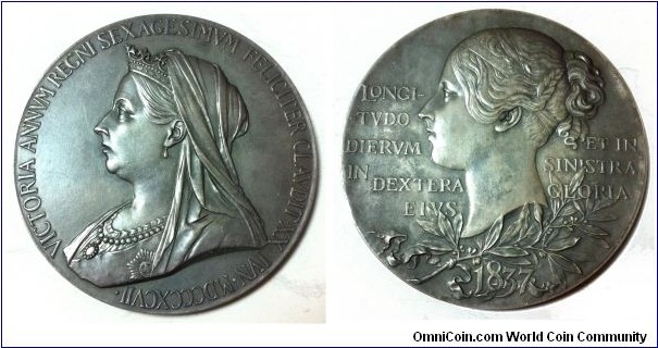 1897 Great Britian Queen Victoria Diamond Jubilee Medal by George William De Saulles after Thomas Brock and William Wyon. Silver 56MM
Obv: Diademed, veiled bust of Victoria facing left. Legend: VICTORIA ANNVM GEGNI SEXAGESIMVM FELICITER CLAVDIT XX IVN.MDCCCXCVII  (Victoria successfully completed the sixtieth year of yer reign, 20 June, 1897). Rev: Young head of Victoria facing left. Legend: LONGI-/TVDO/DIERVM/IN DEXTRA/EIVS/ET IN/SINISTRA/GLORIA. (Length of days is her right hand; and glory in her left hand. Vulgate, Proverbs III 
